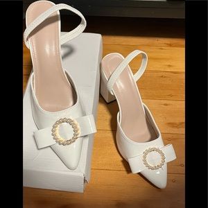 Pointy Toe Pumps with bow and pearl embellishments